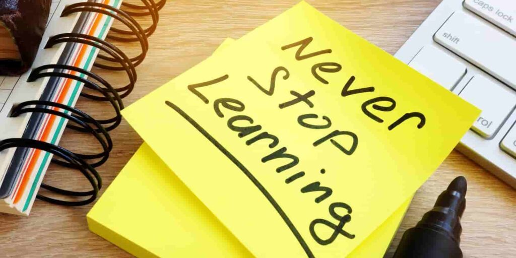 Never stop learning written on a stick. Lifelong learning concept.