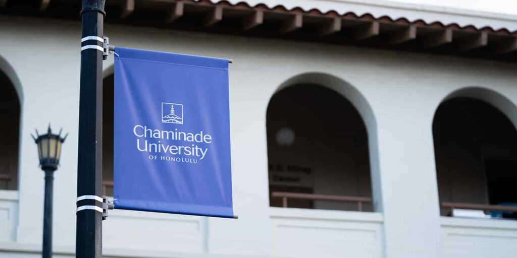 Chaminade University of Honolulu flag in front of Clarence T.C. Ching Hall building