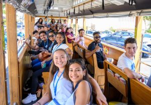 New students on a trolley taking a tour of Kaimuki during New Student Orientation