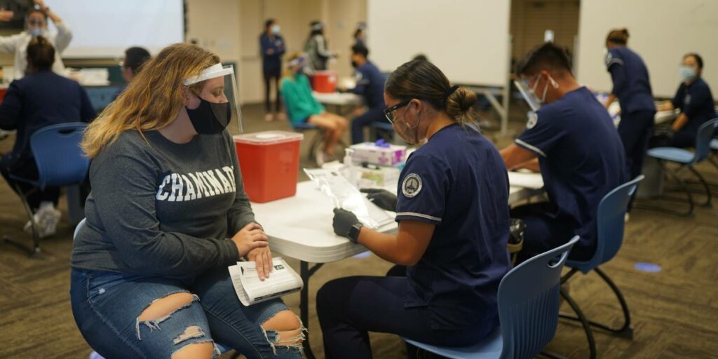 Chaminade nursing students participating in a mock vaccination clinic