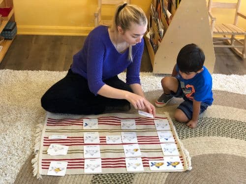 Emily Yerington, MAT '19, sitting with a student teaching