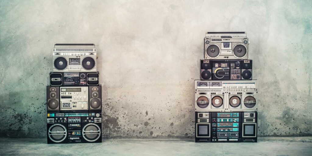 Retro old design boombox radio cassette tape recorders from 1980s front concrete street wal