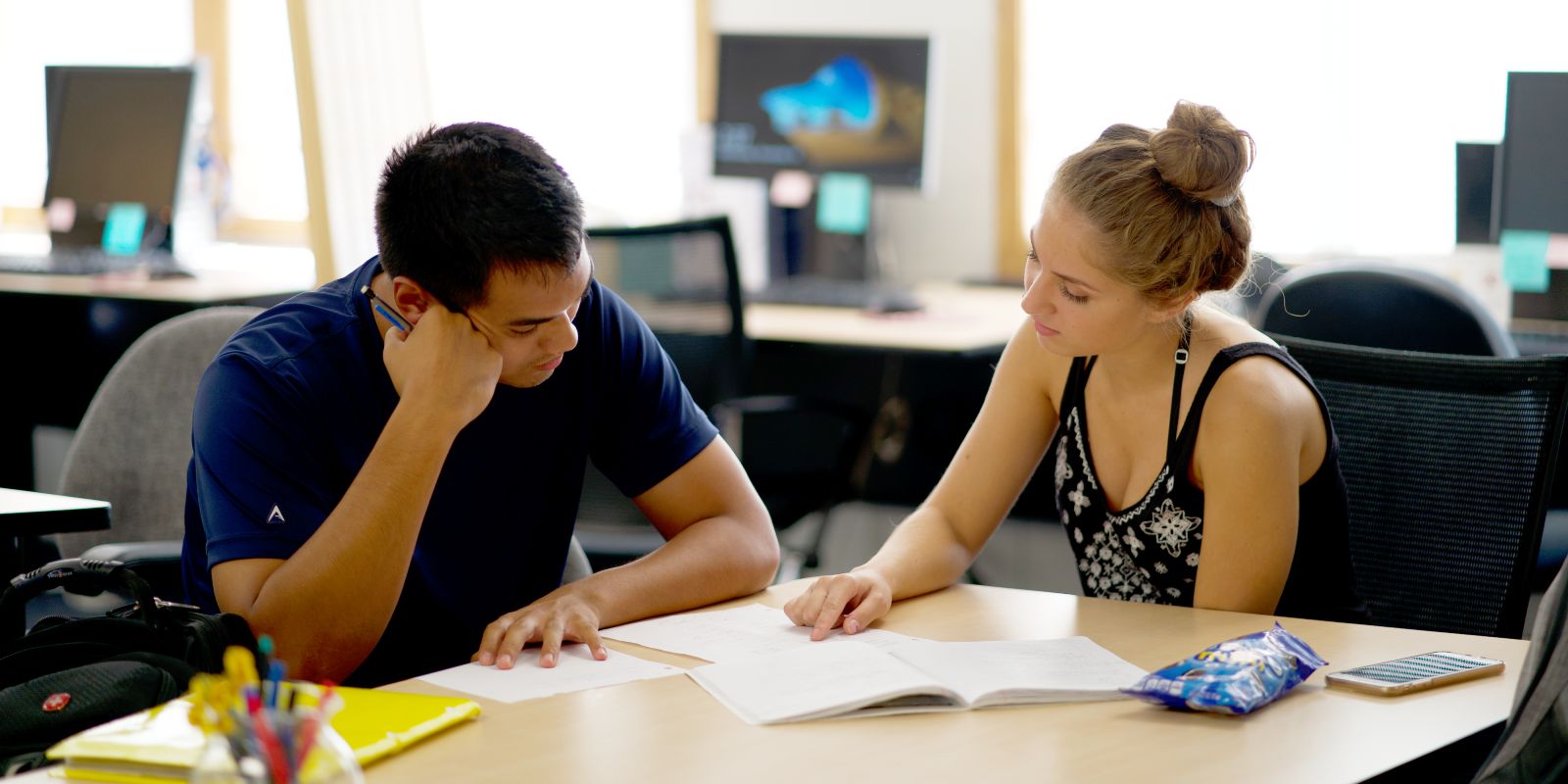 a student tutoring another student