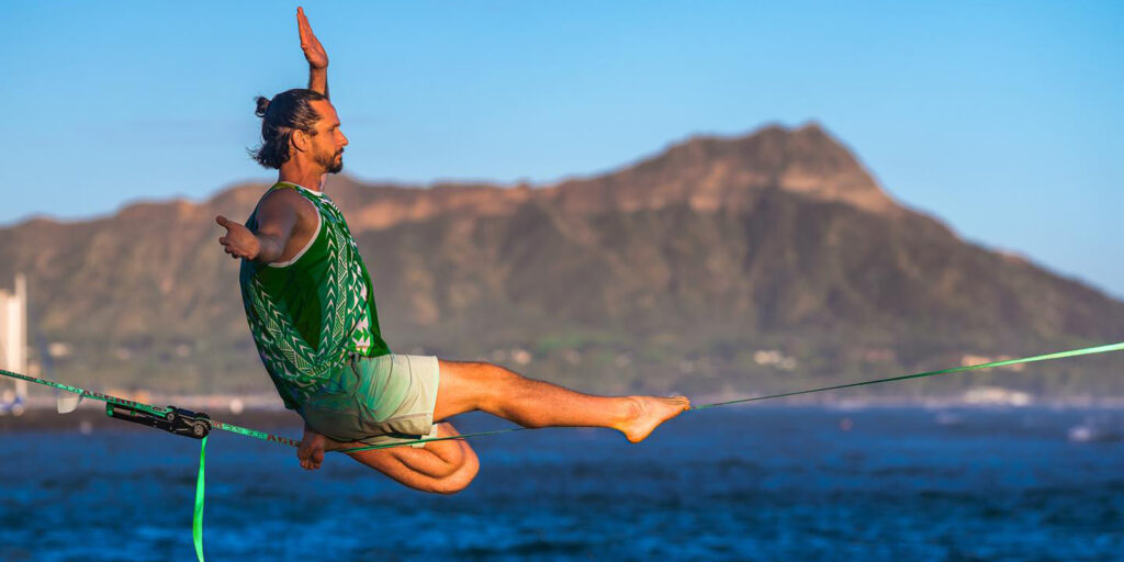 Ryan Panzarella keeps his mind focused when he is on the slackline, a sport that originated with rock climbers and has spread to the urban mainstream, including in Waikiki.
