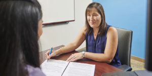 Financial Aid Counselor helping a student with their FAFSA form