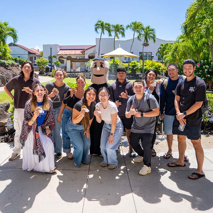 students celebrating fr. chami's birthday