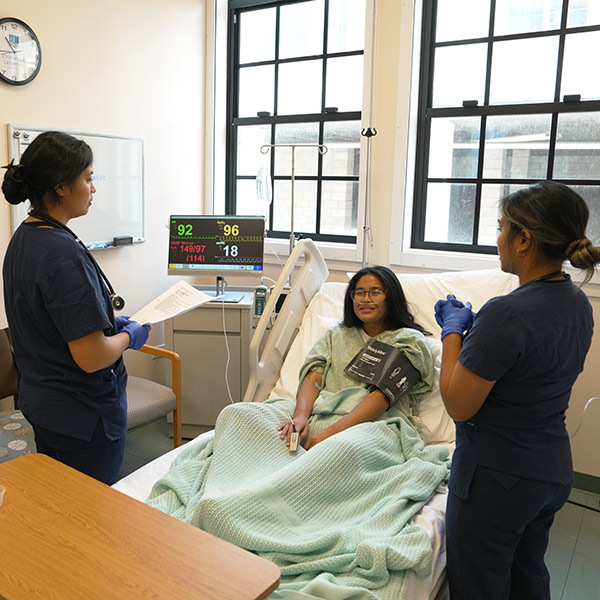 nursing students participating in a simulation