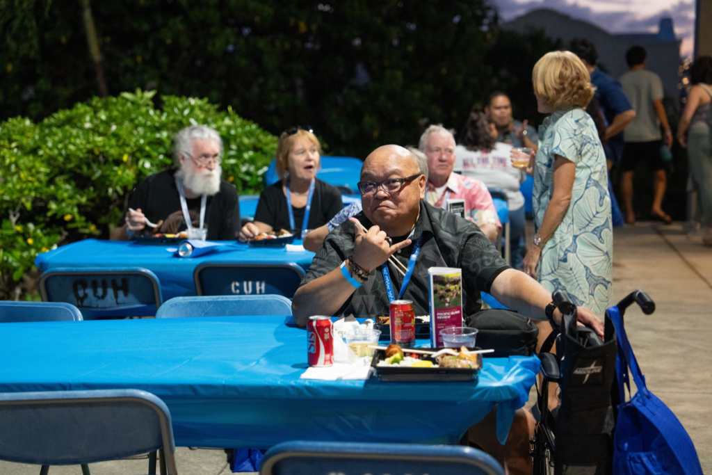 Alumni enjoy a quick bento dinner before the 2025 Pacific Island Review begins.