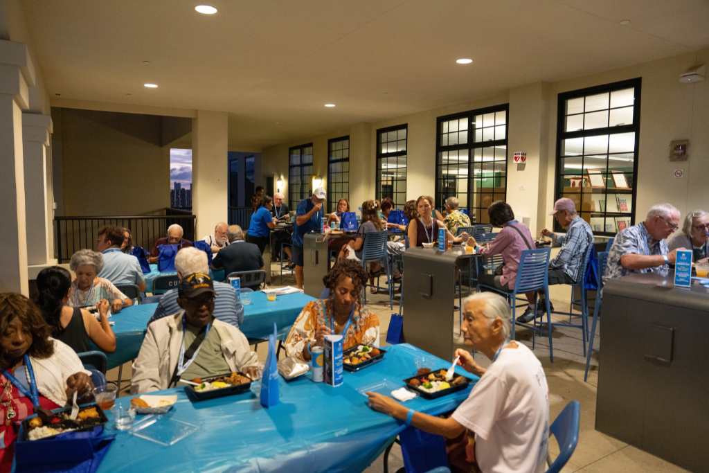 Alumni enjoy a quick bento dinner before the 2025 Pacific Island Review begins.
