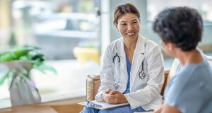 nurse speaking with a patient